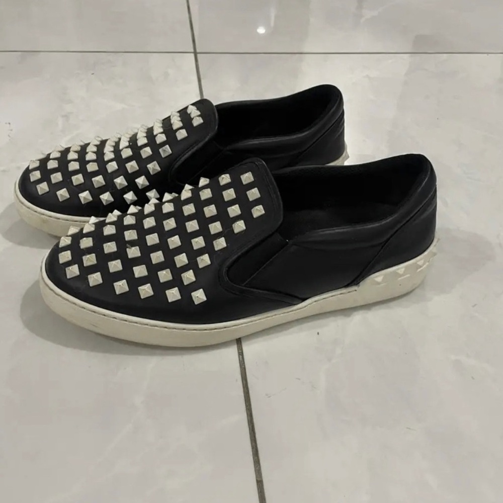 Valentino Garavani Black Slip-On Studded Sneakers with White Accents